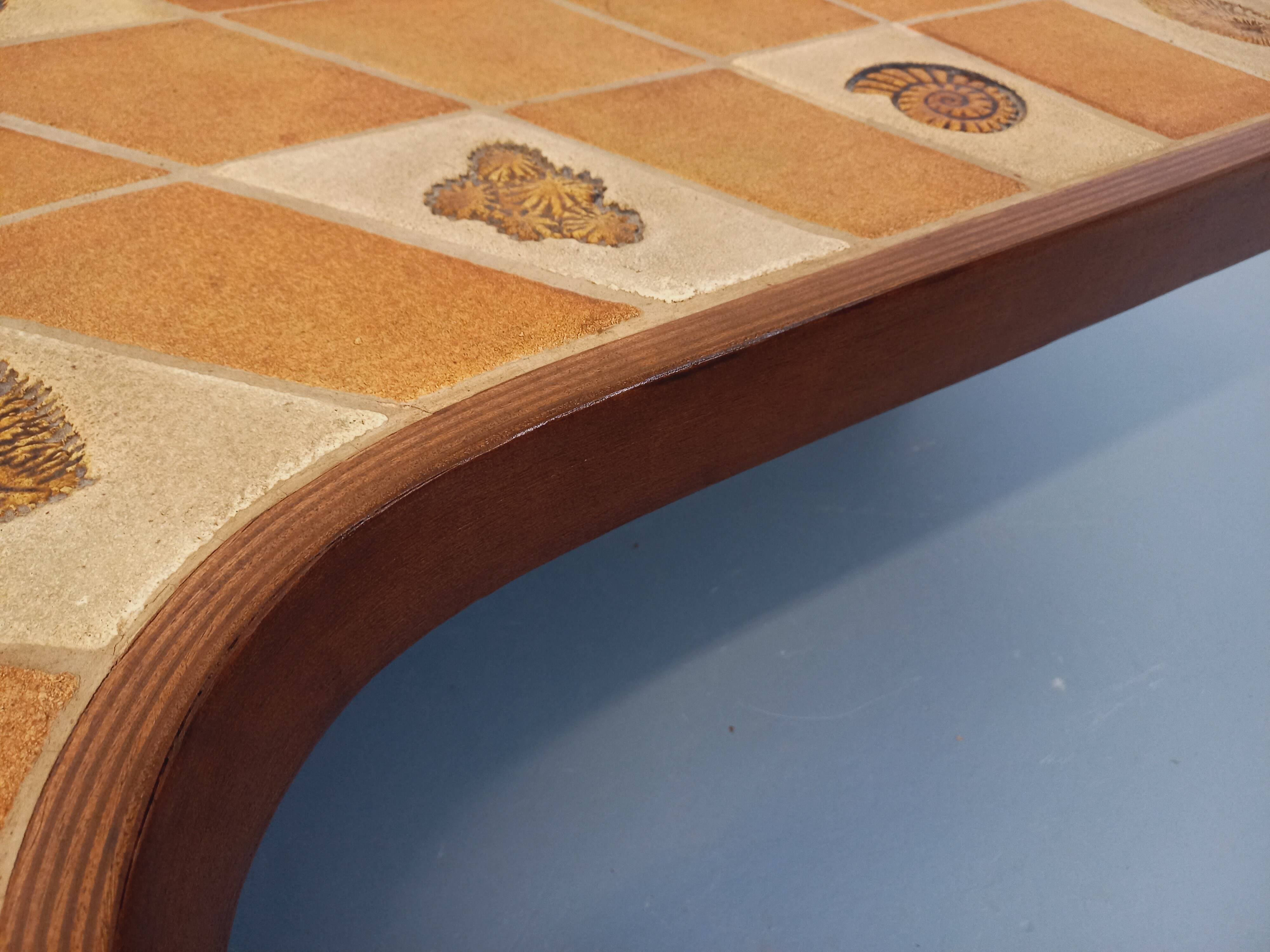 Barrois vintage shell-patterned comma coffee table in wood and ceramic.