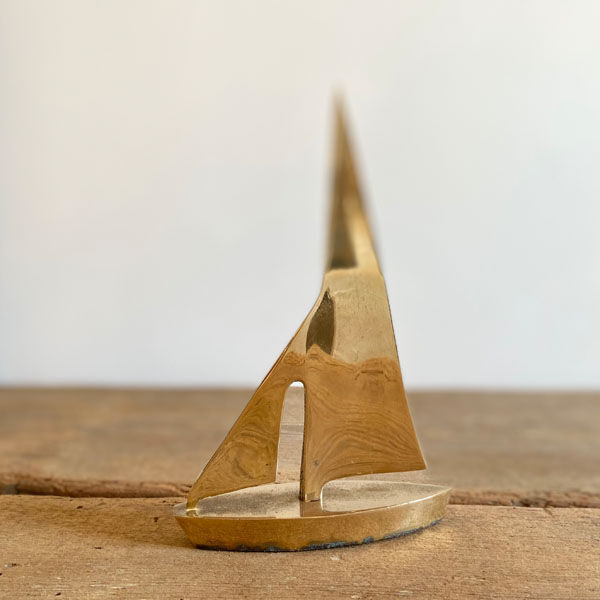 Golden brass sailboat