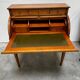 Cylinder desk with marquetry featuring a crosshatch design.