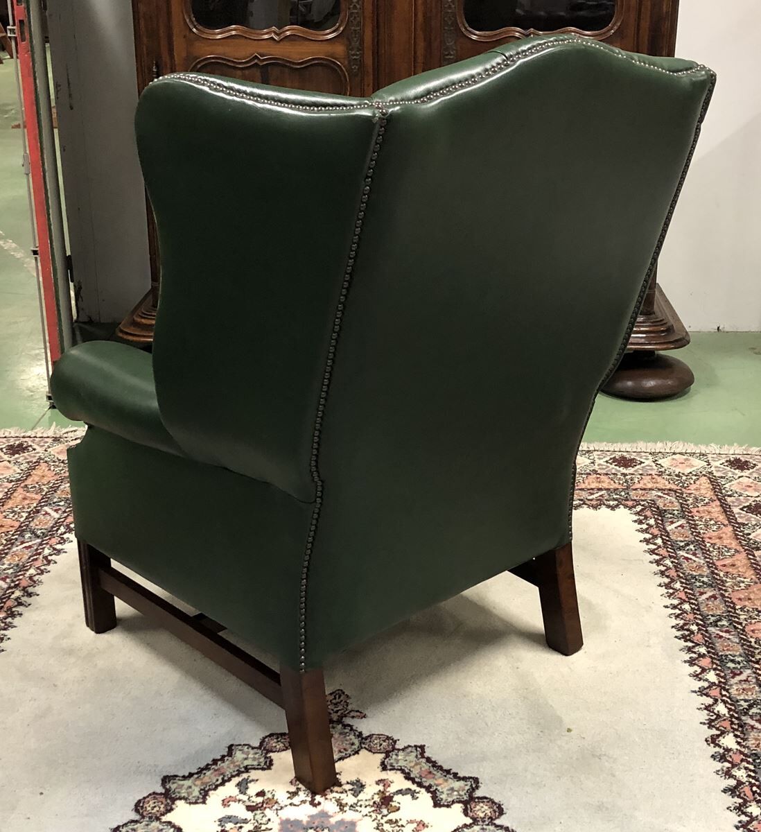 In the 1970s green leather Chesterfield armchair