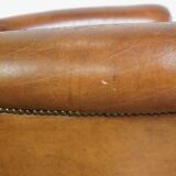 Beautiful and comfortable sheepskin armchair, finished with decorative nailheads