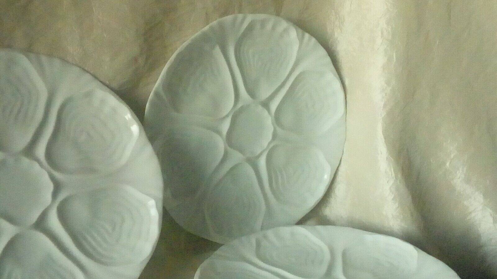 White porcelain oyster plates