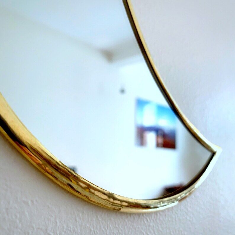 Moon-shaped gilded brass wall mirror, 24x9 cm