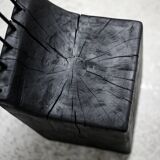 Brutalist chair, black-stained raw wood, steel. Work from the 1970s