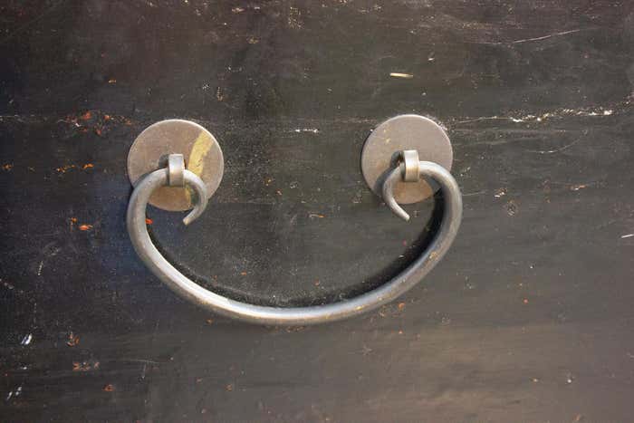 Brown and gold lacquered Chinese chest decorated with flowers circa 1900