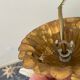 Golden metal chandelier decorated with flowers