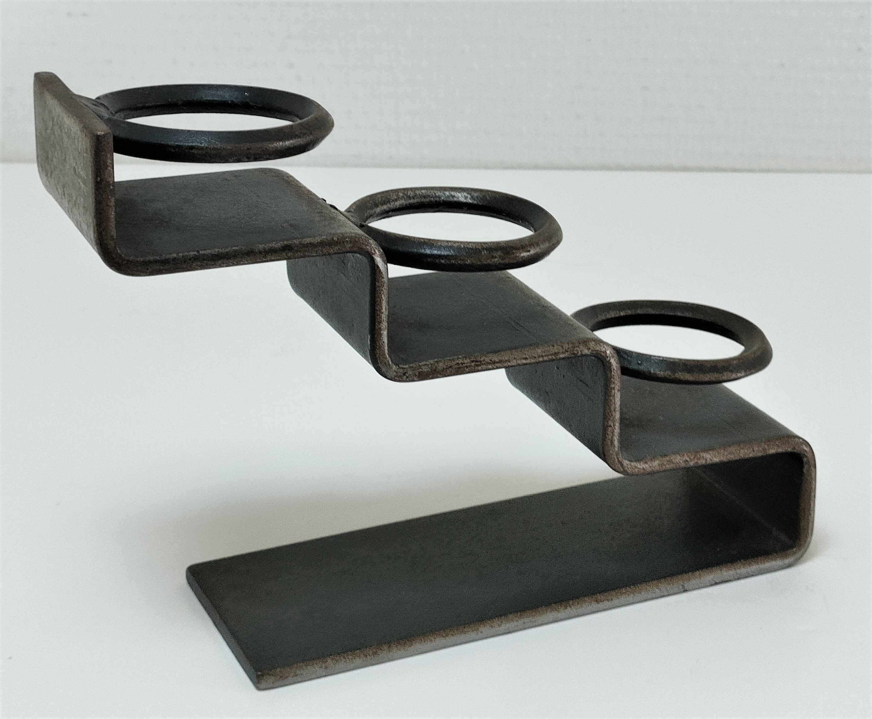 Sculptural candle holder patinated steel design 80s