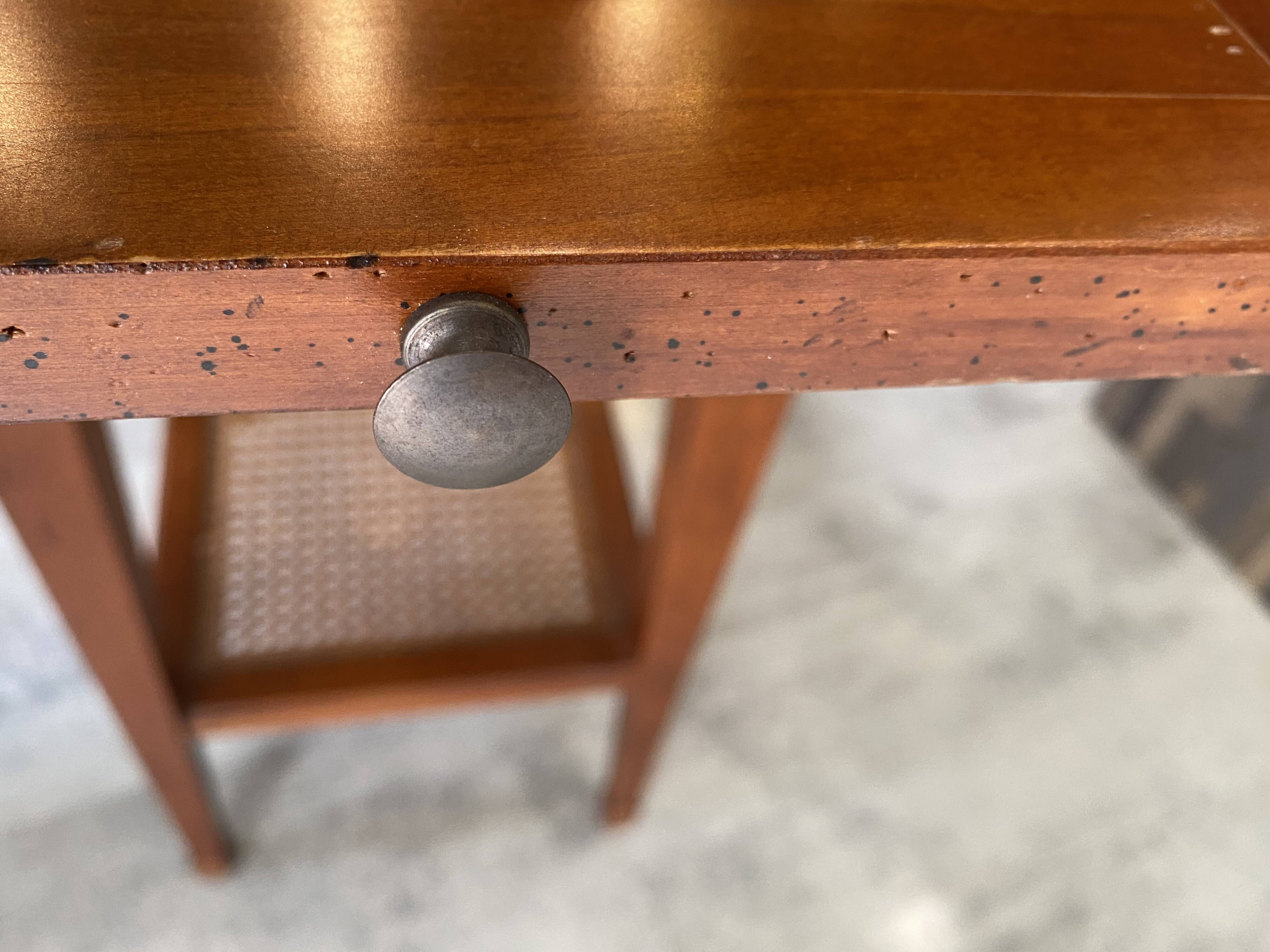 Occasional table in cherry wood, 1 drawer, 1 cane shelf, 1950.
