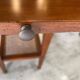 Occasional table in cherry wood, 1 drawer, 1 cane shelf, 1950.