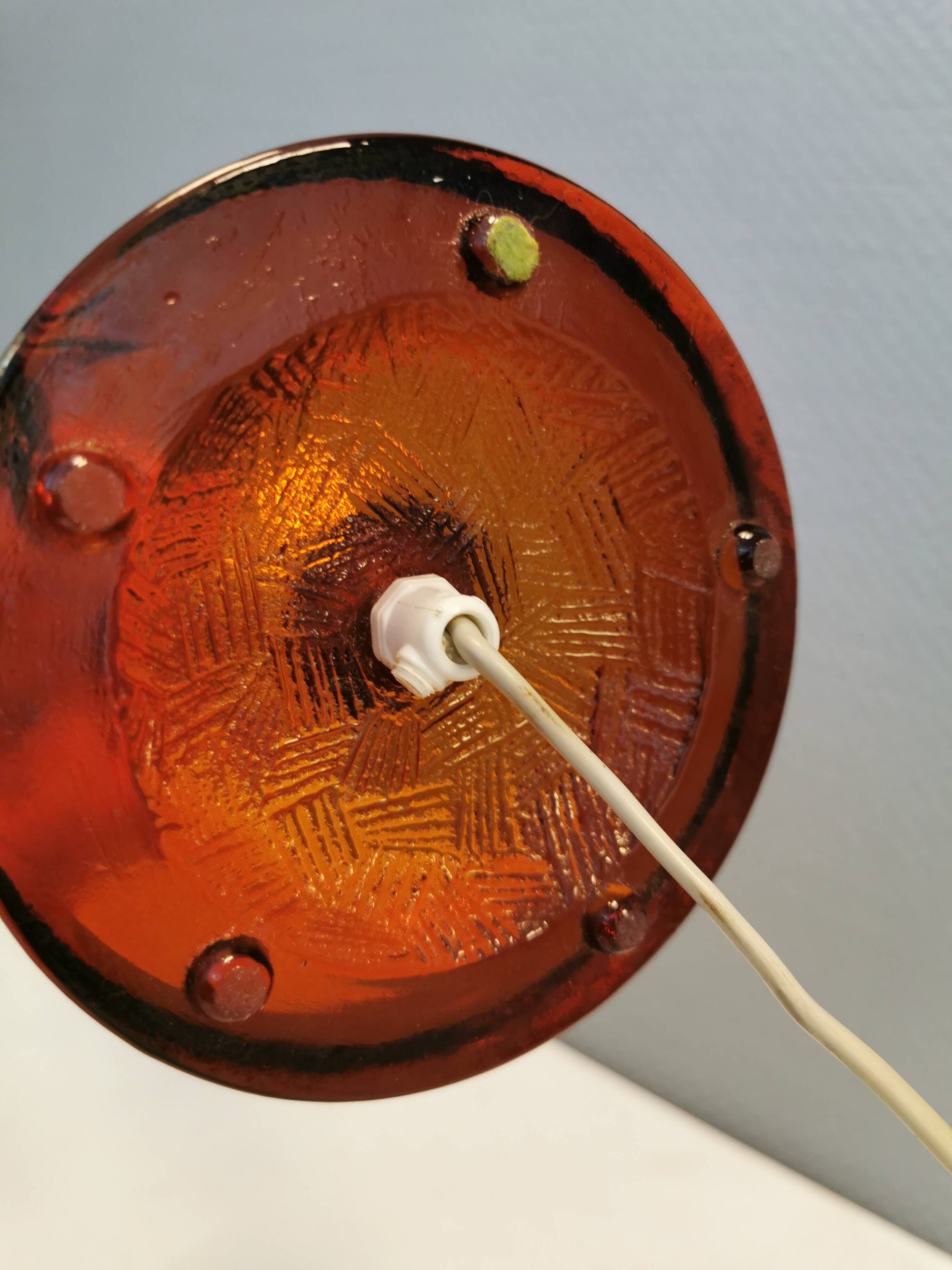 Table lamp from Danish Vitrika in brass, amber colored hard pressed glass, with a shade holder.