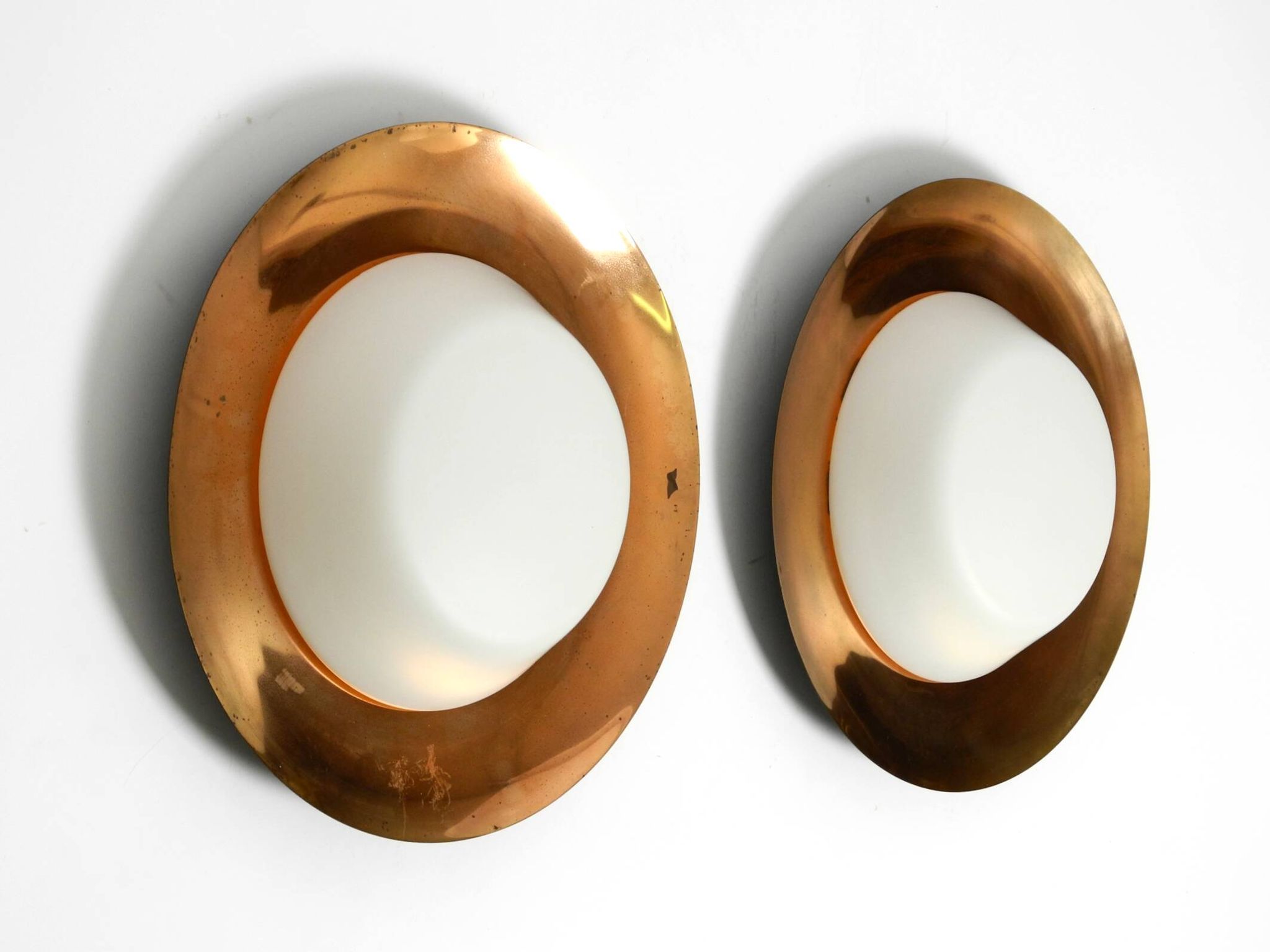 Pair of Mid Century wall or ceiling lamps made of glass with copper-plated