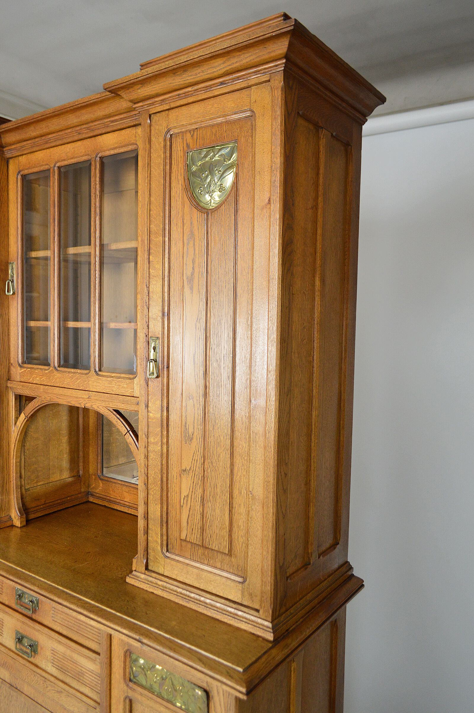 Art Nouveau oak buffet and dinanderie panels, circa 1910