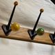 Coat rack with 5 double metal hooks and vintage wooden balls from the 1950s.