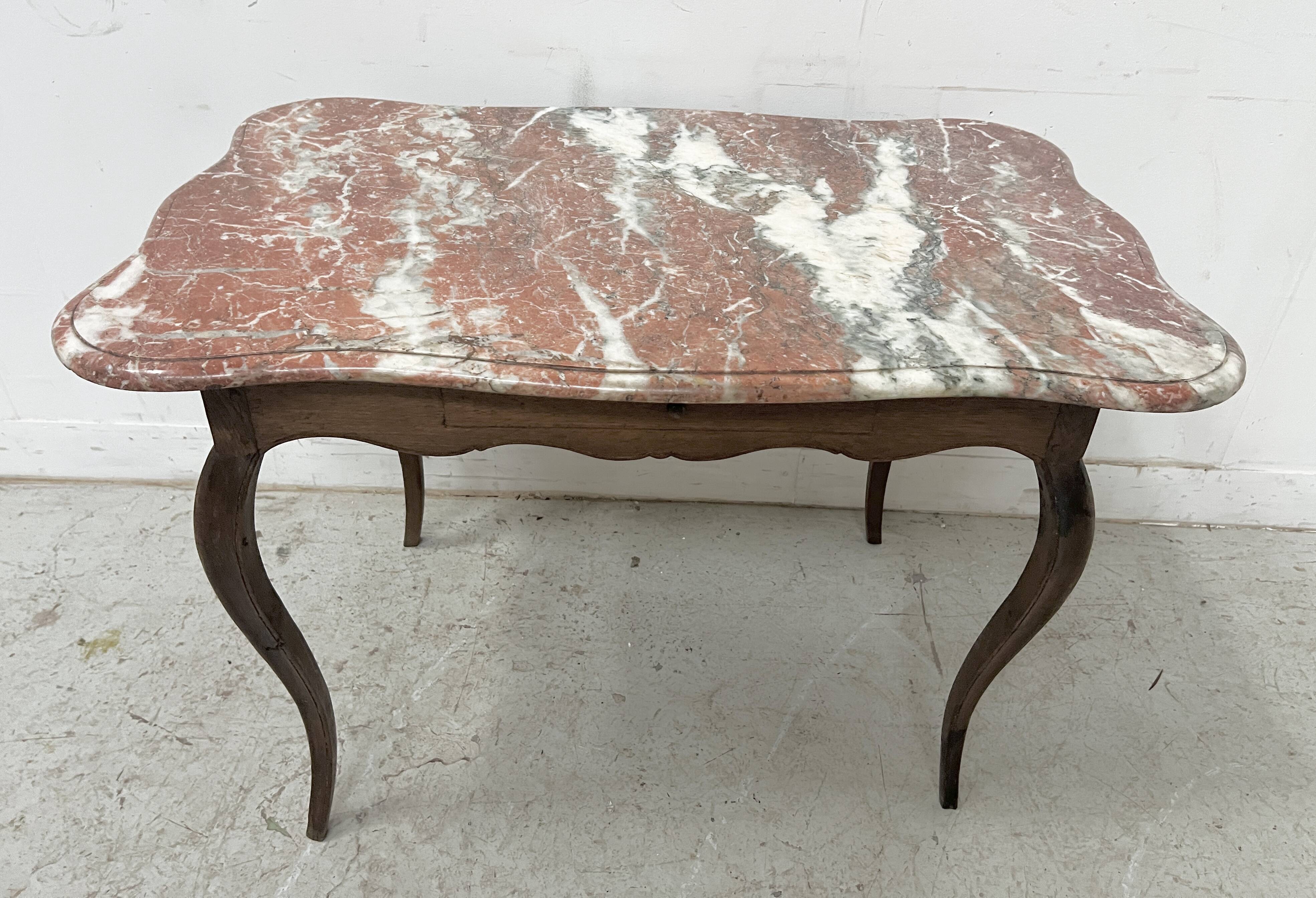 Louis XV mid-table in oak and marble, 18th century.