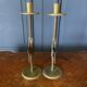 Pair of brass candlesticks decorated with 20th century stars