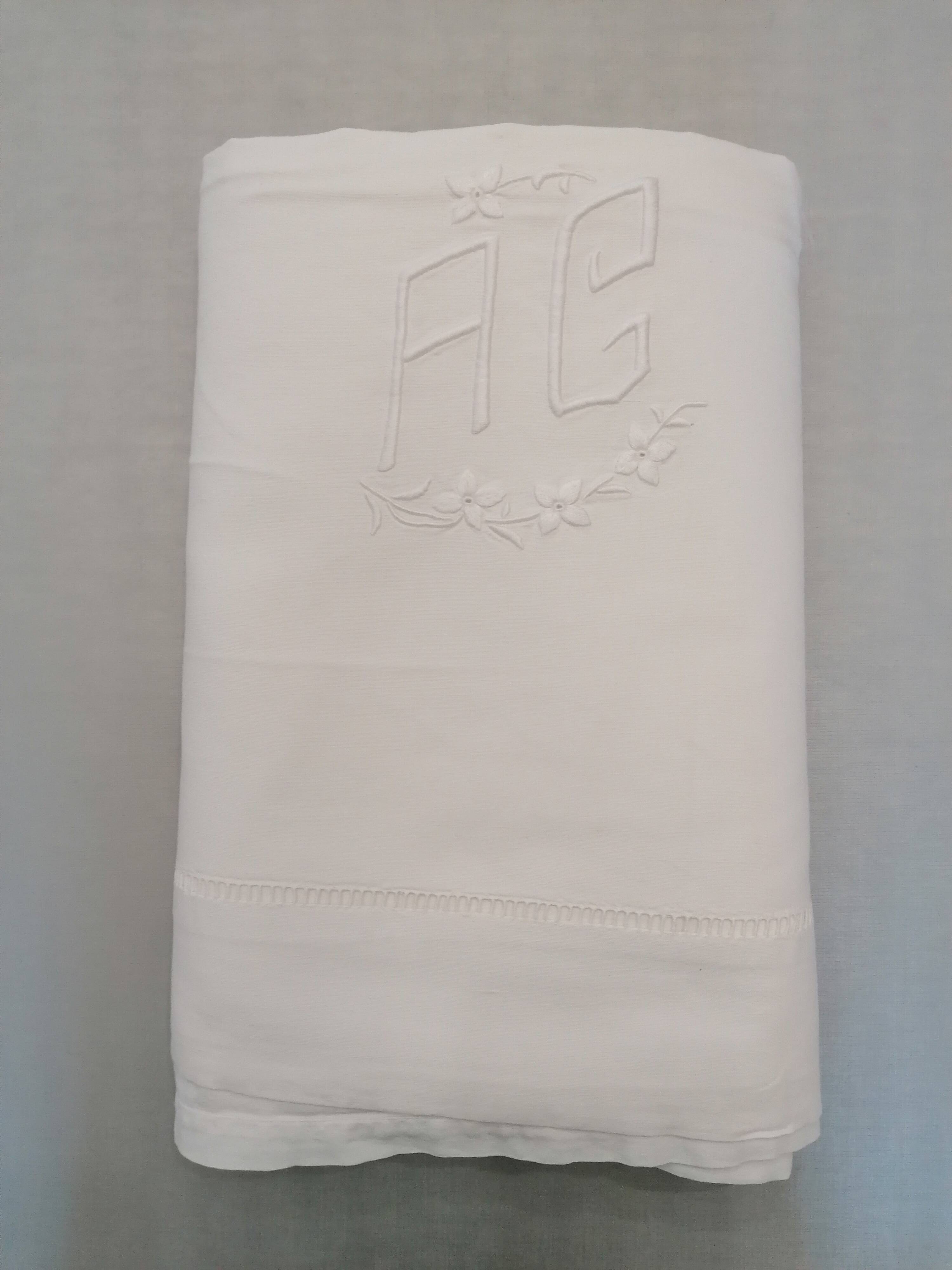 Antique white flat sheet embroidered with “AG”