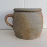 Ancient sandstone pot at one handle