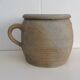 Ancient sandstone pot at one handle