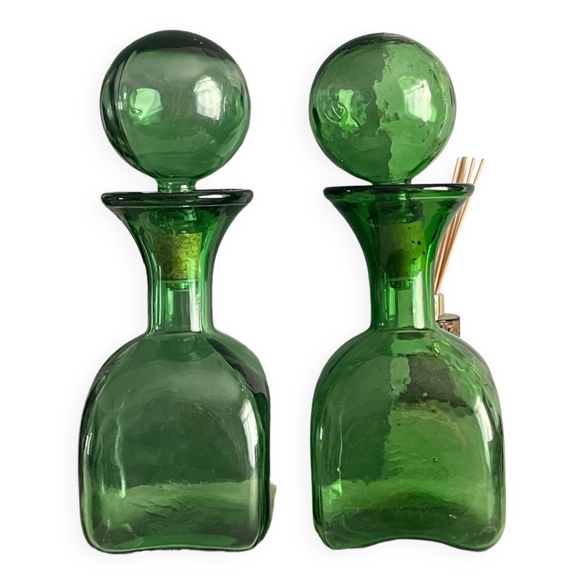 Two green glass decanters