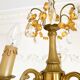 Small vintage brass chandelier with amber crystal pendants.