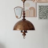 Rustic old wooden and brass suspension.