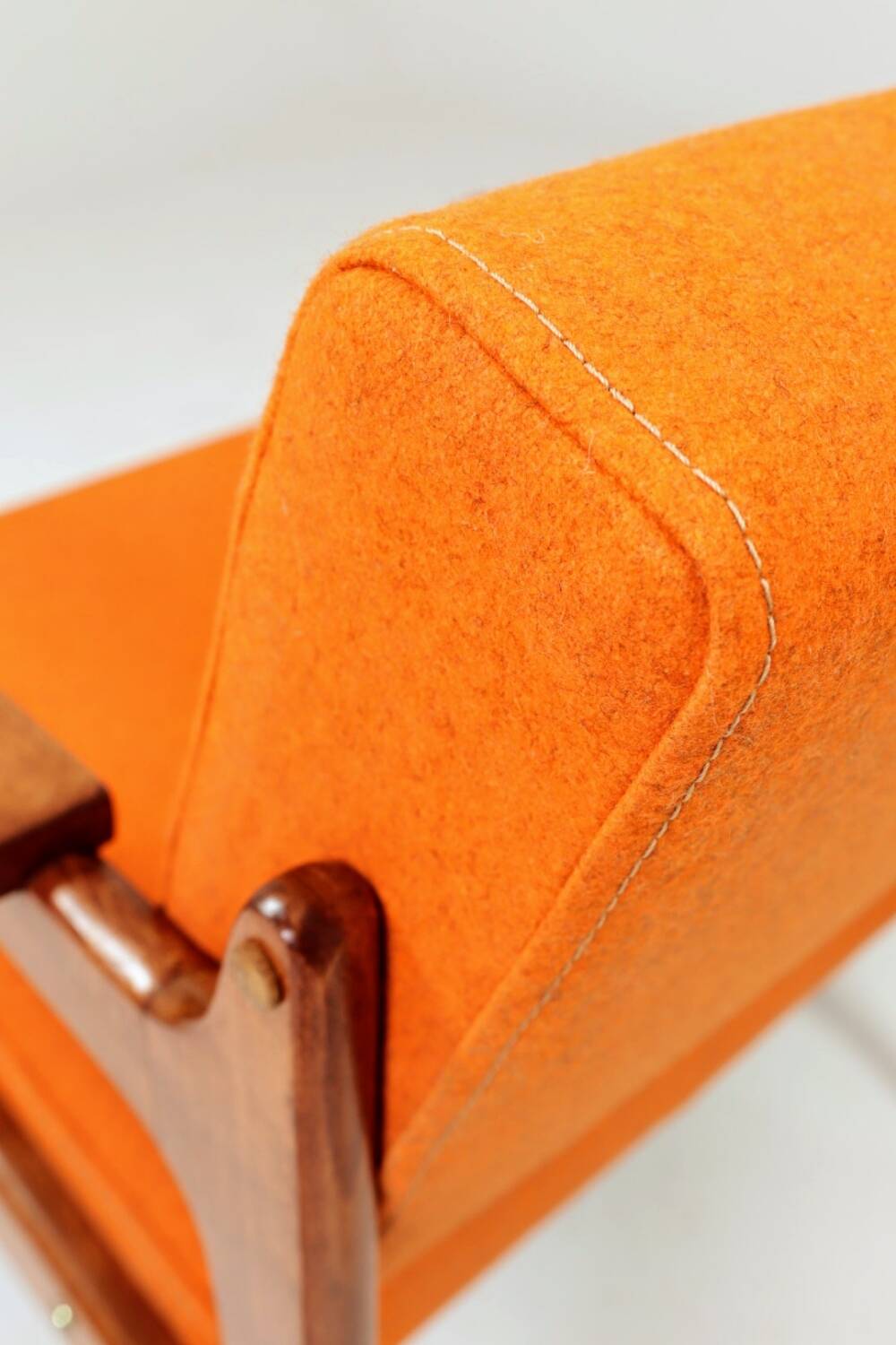 Vintage armchair in papaya orange wool from the 1960s.