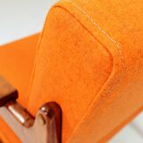 Vintage armchair in papaya orange wool from the 1960s.