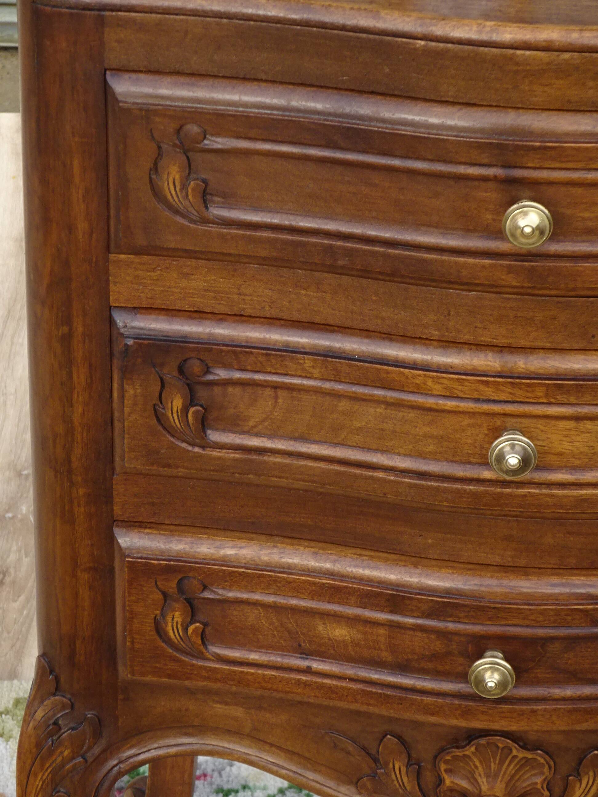 Louis XV bedside table in walnut, 3 drawers, raised edges on the tops.