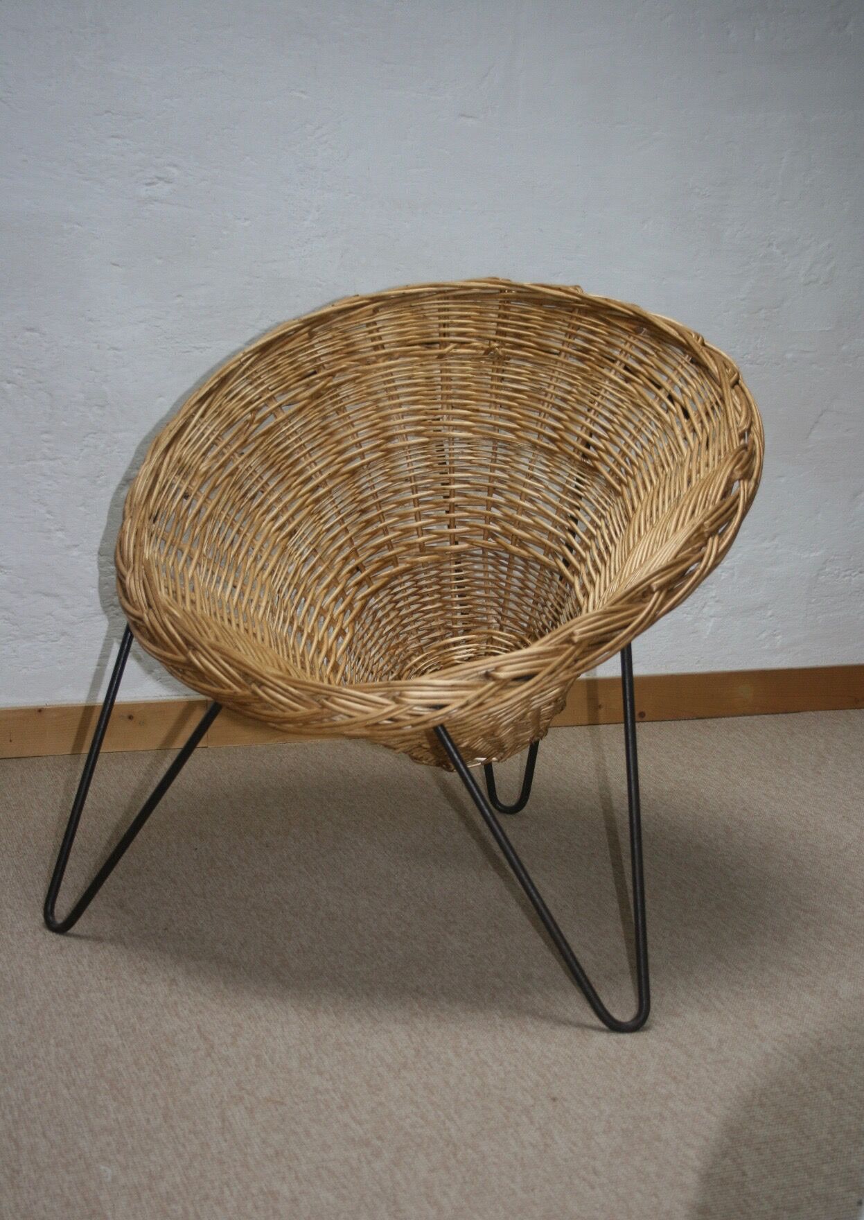 Wicker basket armchair in the 50s