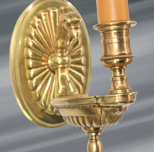 Pair of gilt bronze wall sconces in the Directoire style by Lucien Gau.