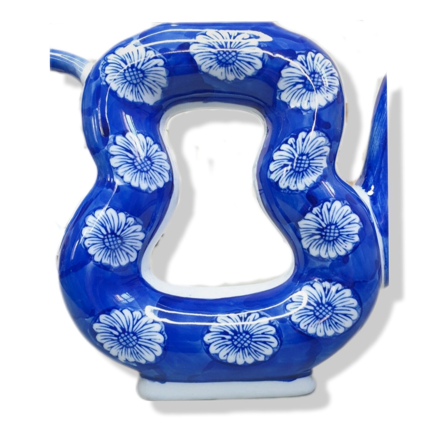 Old Asian teapot in toroidal shape in blue porcelain with floral decoration 20th century