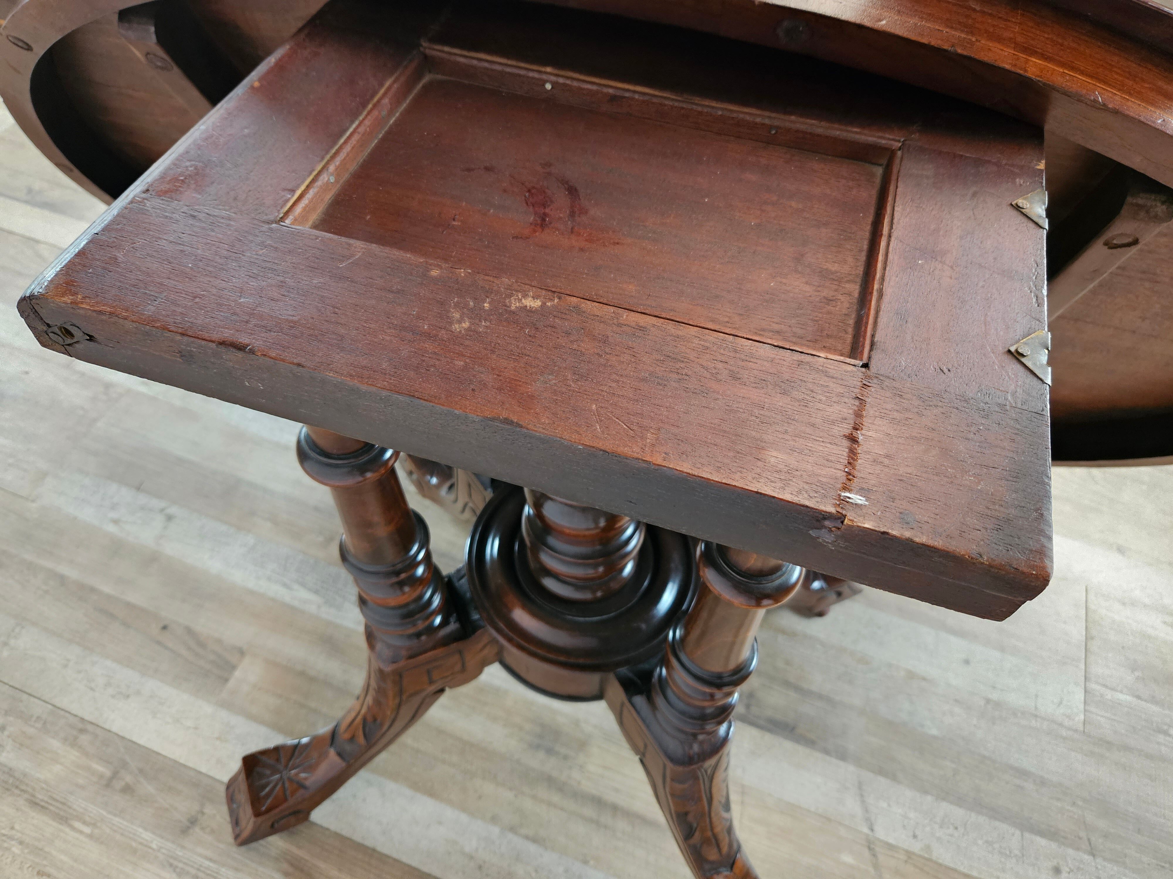 Coffee table in walnut with maple inlays and wheels