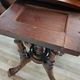 Coffee table in walnut with maple inlays and wheels