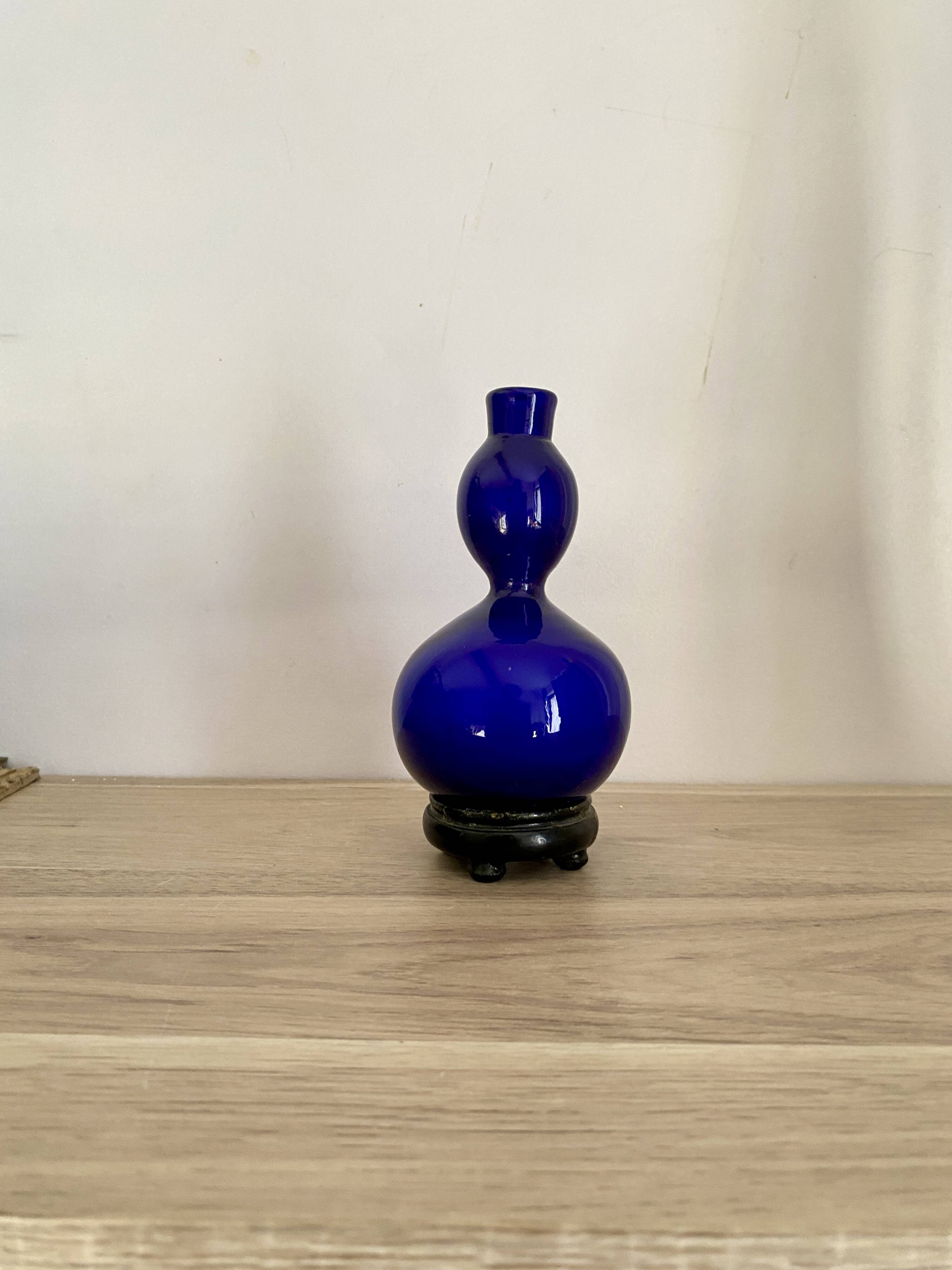 Blue opaline vase, wooden base