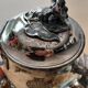 Teapot and sugar bowl in silver-plated metal.