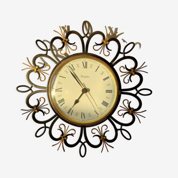 Wall clock Vedette in black and gold wrought iron 1960.