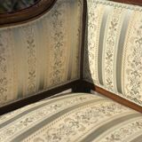 Low armchair in finely carved wood in the Louis XVI style from the 19th century