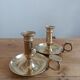 Duo of gilded brass cellar rat candlesticks