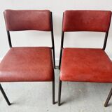 Pair of vintage stacking chairs with red vinyl upholstery