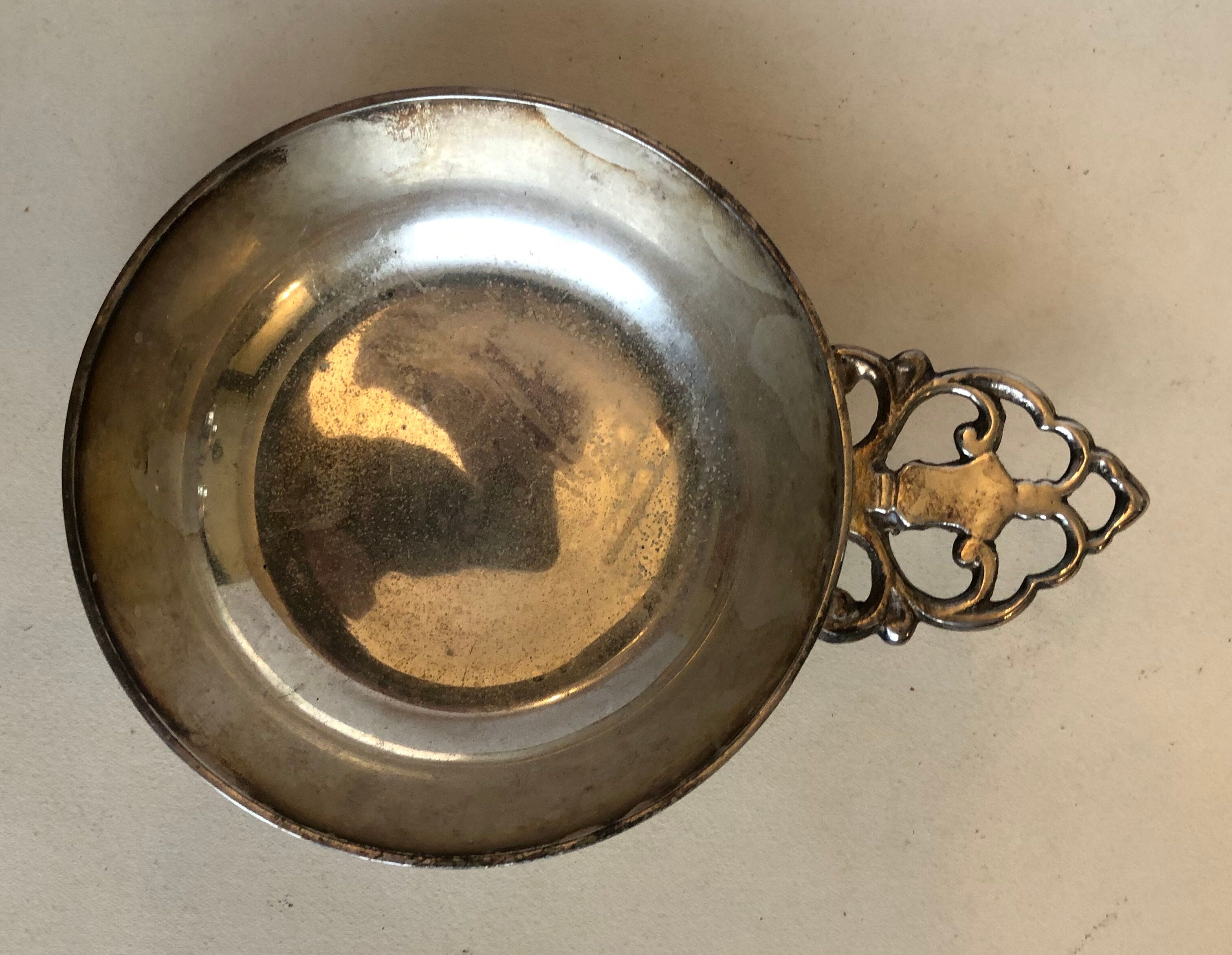 Silver metal tastevin