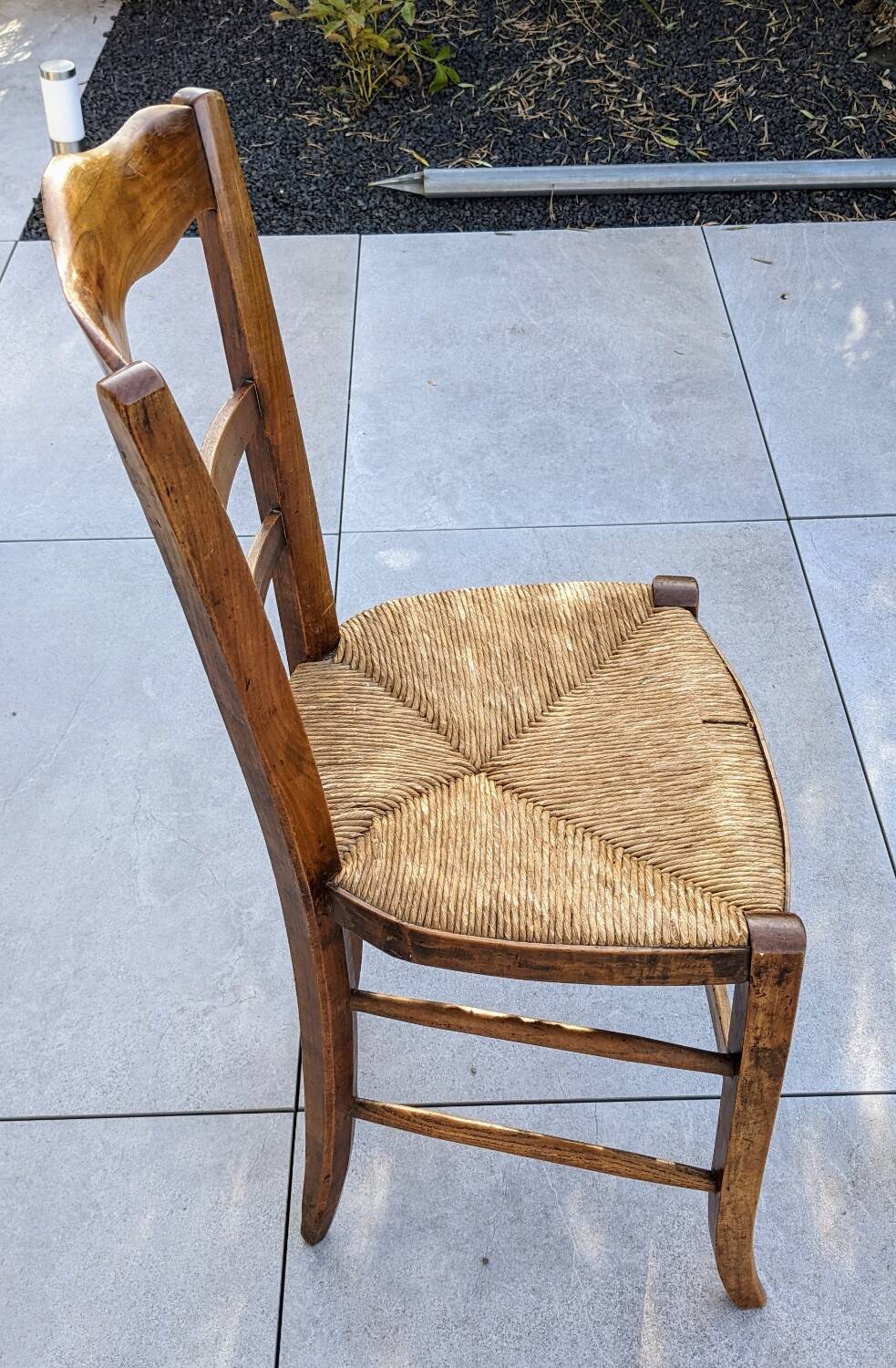 4 mismatched wood and straw chairs