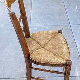 4 mismatched wood and straw chairs
