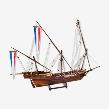 Model boat under wood and glass showcase