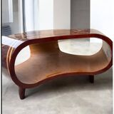 An Art Deco coffee table in multi-colored beech and rosewood.