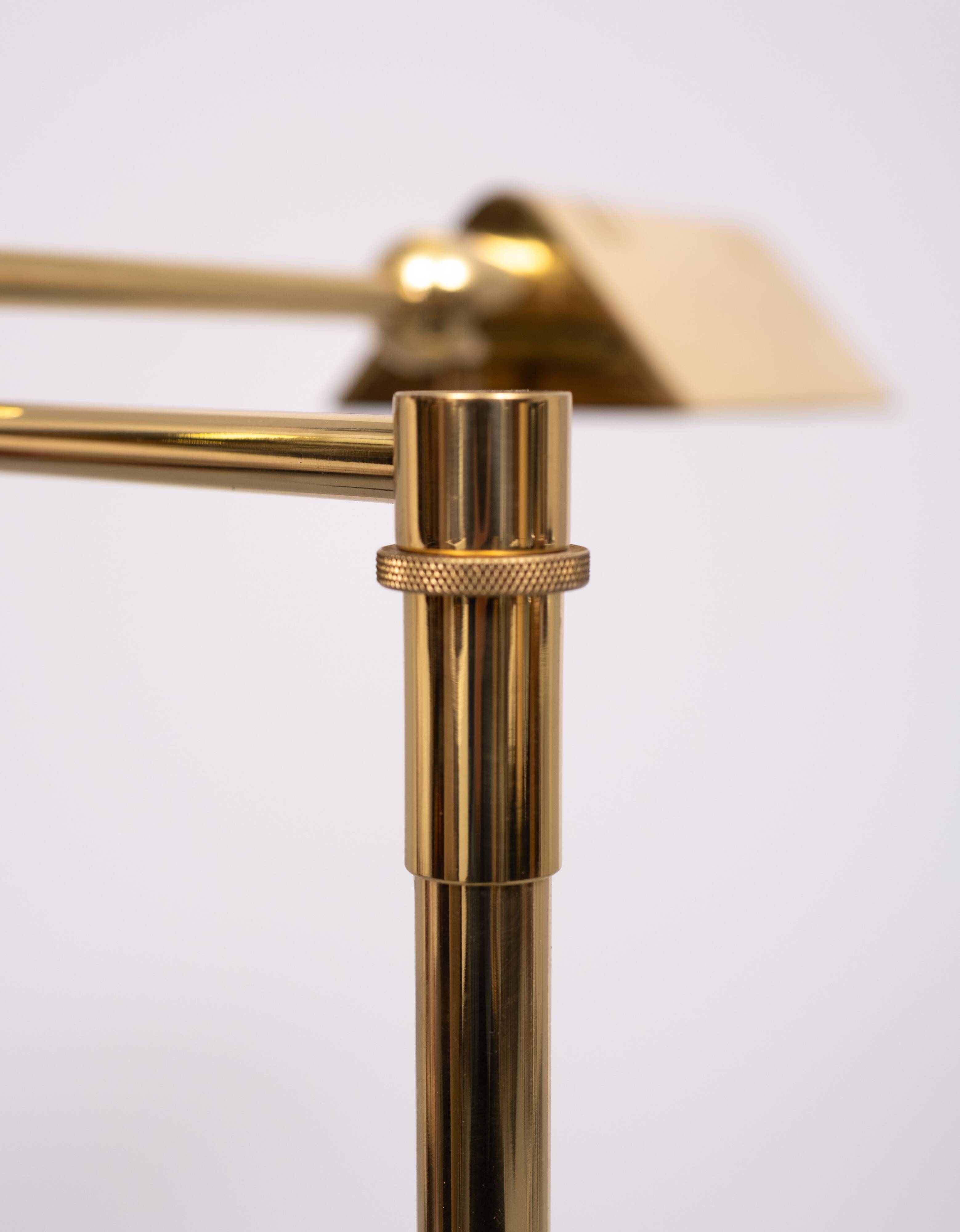 Holtkoetter adjustable Brass swing arm floor lamp. Germany