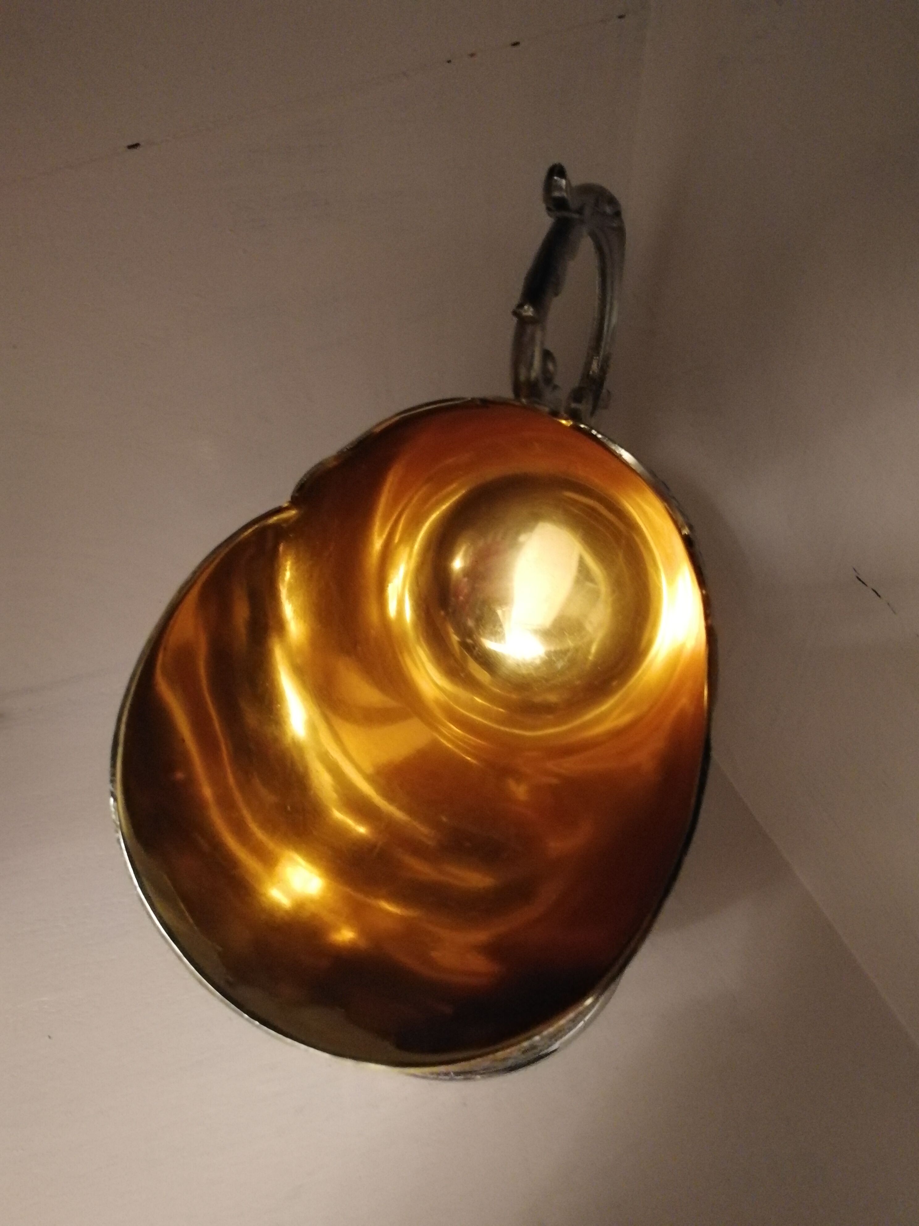 Sugar and sugar shovel in golden silver metal