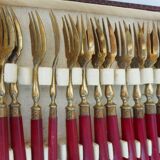 Twelve bakelite handle cake forks