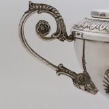 Silver sugar bowl with paw feet and ornate handles