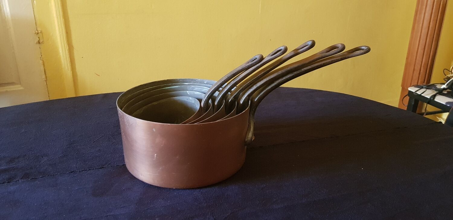 Series of 5 tinned copper saucepans. Great height.
