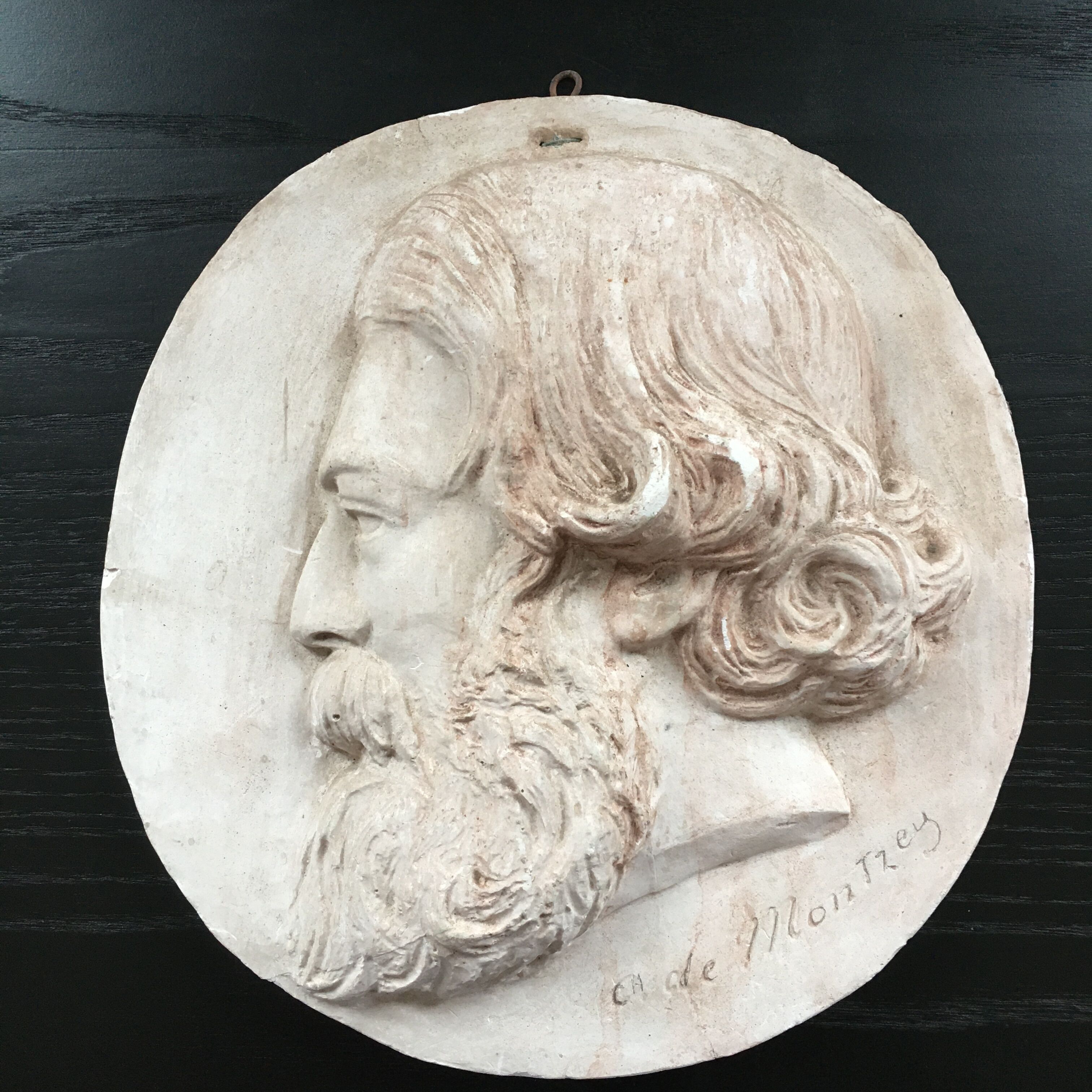 Plaster medallion figure